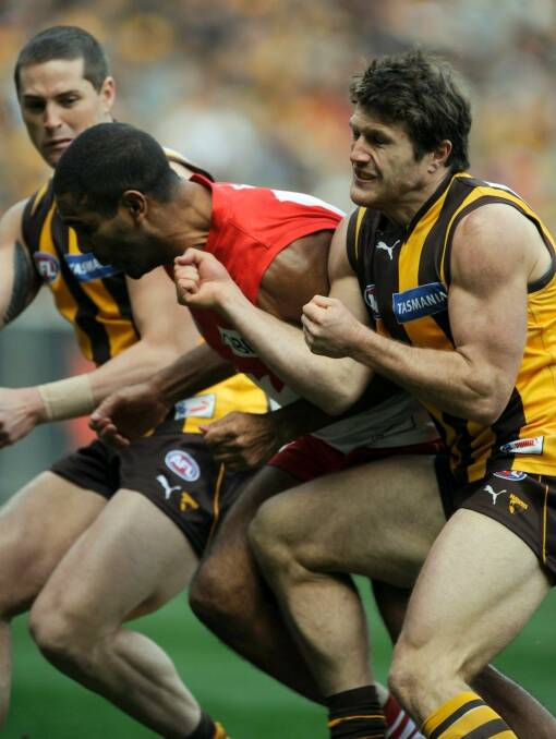 Hawthorn's Campbell Brown crunches Sydney's Michael O'Loughlin.