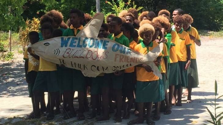 Warm welcome: Local school children welcome present and former Bulldogs. Photo: Supplied