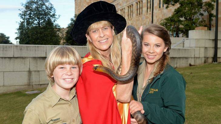 Terri Irwin with son Robert and daughter Bindi after receiving her honorary degree from the University of Queensland. Photo: Bradley Kanaris