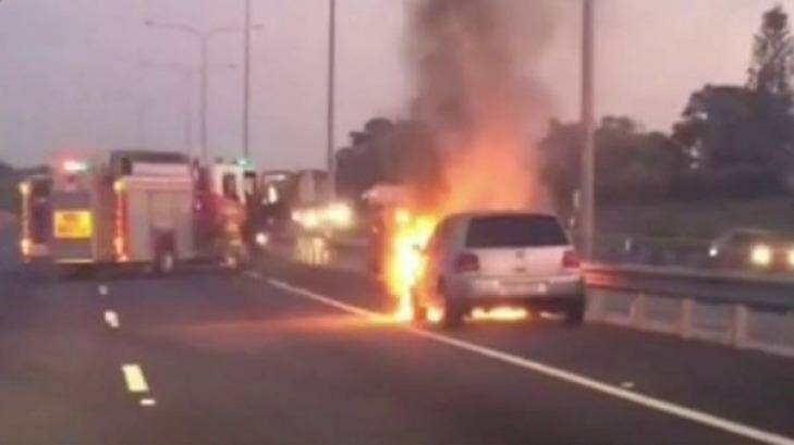 A car fire closed three lanes on the Pacific Motorway. Photo: Jorge Branco