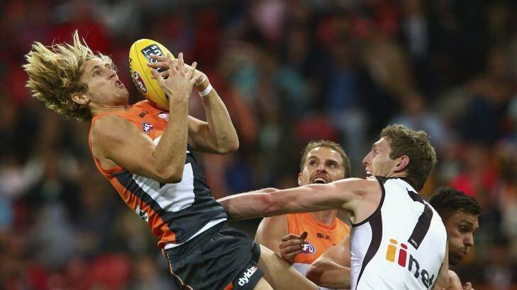 High flyer: Nick Haynes takes a mark for GWS against Hawthorn. Photo: Getty Images 