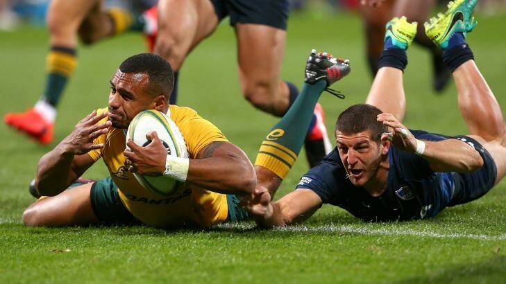 Will Genia crosses for a try with Argentina's Tomas Cubelli in pursuit in Perth on Saturday. Photo: Paul Kane