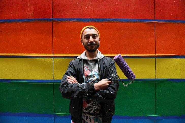 Artist David Lee Pereirahe and the Apparition team paint a pro-gay marriage mural at Knox Lane in Melbourne, Sunday, August 27, 2017. Inspired by anti-gay marriage graffiti, artist David Lee Pereira put out a call on Facebook, and was met with the support of Melbourne businesses to encourage a yes vote in support of equal rights. Apparition Media artists and members of the wider community will be donating their time this weekend, to painting the donated walls of Melbourne in rainbow.(AAP Image/Tracey Nearmy) NO ARCHIVING