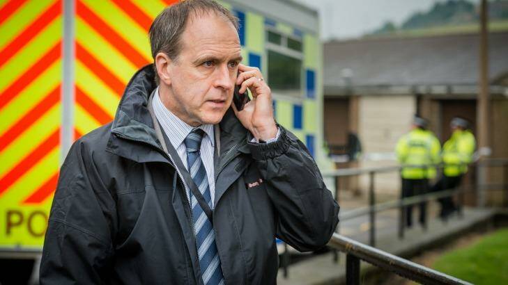 <i>Happy Valley</i>'s harried police detective John Wadsworth (Kevin Doyle), trying to decipher a mumbled phone call. Photo: Ben Blackall