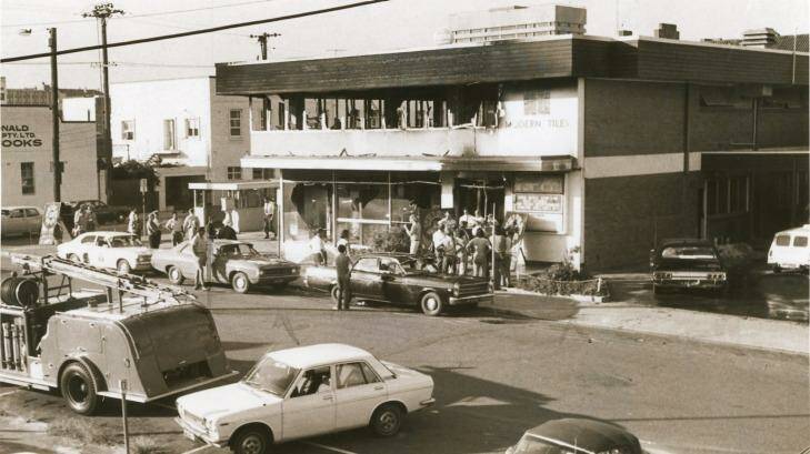 Onlookers outside Brisbane's burnt-out Whiskey Au Go Go in March 1973.