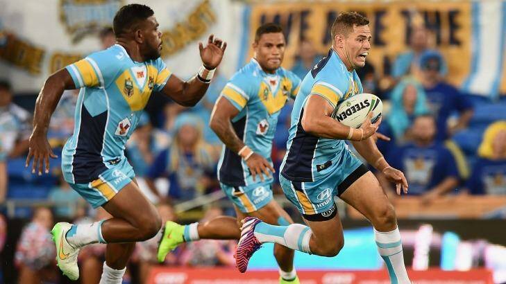 Aidan Sezer makes a break during the round one match between the Gold Coast Titans and the Wests Tigers. Photo: Matt Roberts/Getty Images
