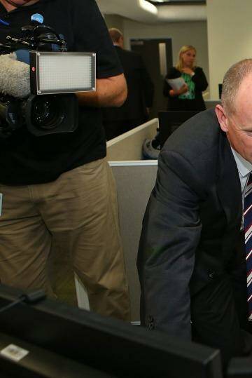 Premier Campbell Newman and Mick Smith, CCTV manager, meet at the G20 operations room at Brisbane Airport. Photo: Chris Hyde