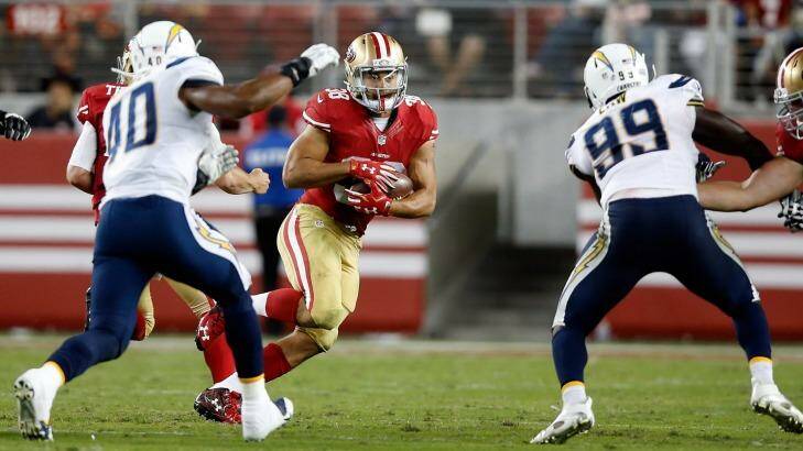 Jarryd Hayne runs with the ball against the San Diego Chargers. Photo: Ezra Shaw