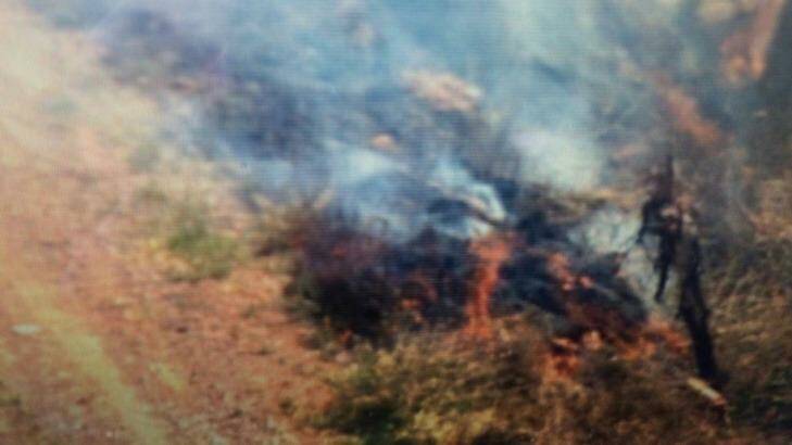 A grass fire burns after a gyrocopter crash at Lefthand Branch, near Gatton. Photo: Shannon Marshall-McCormack