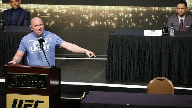 UFC president Dana White speaks beside an empty chair where Conor McGregor was supposed to sit during a news conference for UFC 200. Photo: John Locher
