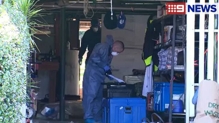 Police at the Key Street property in Morningside where Peter Milos's body was found. Photo: Nine News