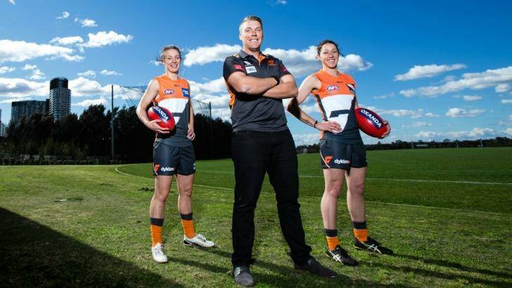 Call for more contact: GWS women's coach Tim Schmidt with Emma Swanson, and Renee Forth in Sydney. Photo: Mark Nolan/AFL Media
