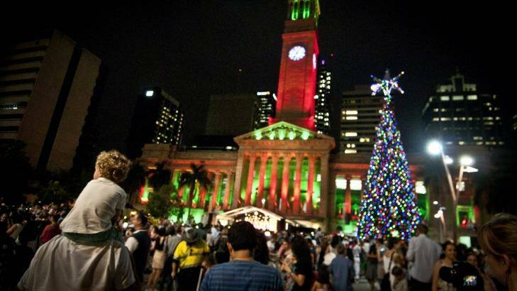 King George Square will again glow under the lights of the giant Christmas tree and an illuminated City Hall. Photo: Robert Shakespeare
