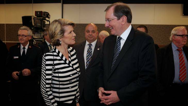 Foreign Affairs Minister Julie Bishop speaks with Loughnane in 2013.  Photo: Alex Ellinghausen