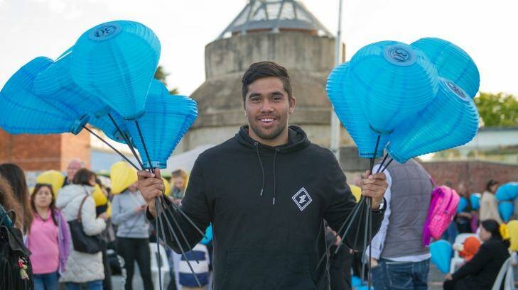 Jarrad Butler Carries 2 fists full of the Blue Lanterns friends family and the 1000s of supporters at the Canberra Leukaemia Foundation Light the Night walk to help more Australians beat blood cancer through research and support Photo Jay Cronan Photo: Jay Cronan
