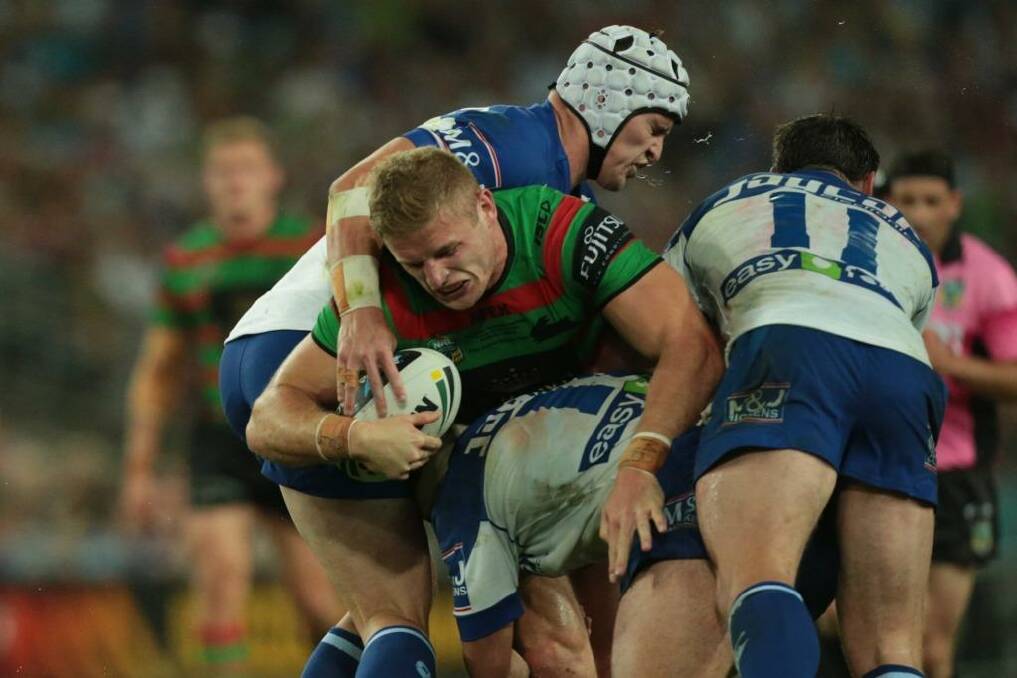 Monster pack ... South Sydney's  George Burgess takes on the Canterbury defence during the grand final  Photo: Christopher Chan