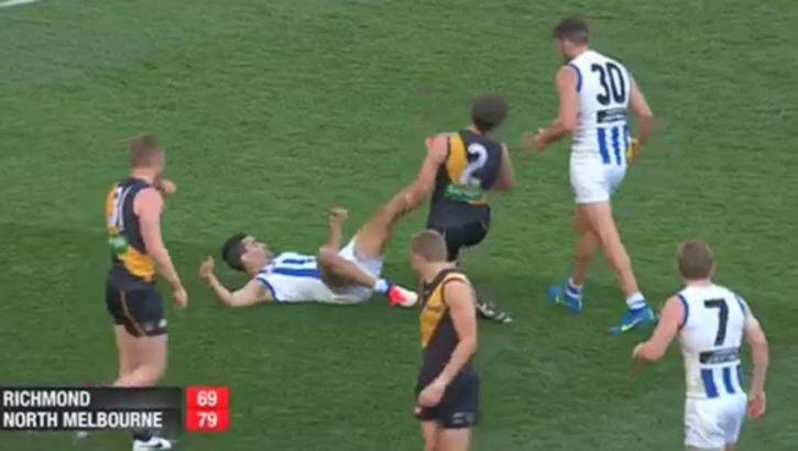 On report: Lindsay Thomas appears to kick Dylan Grimes Photo: Channel Seven