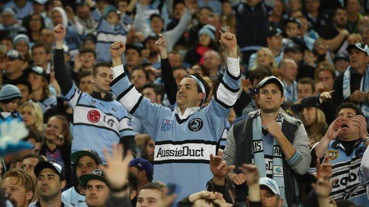 True black, white and blue: Sharks supporters cheer during the NRL Preliminary Final match against the North Queensland Cowboys at Allianz Stadium. Photo: Mark Kolbe
