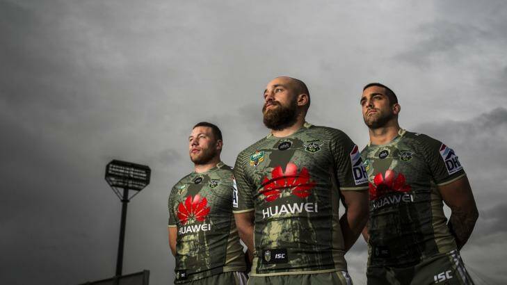 Canberra Raiders players Shannon Boyd, Kurt Baptiste, and Paul Vaughan wear the Anzac day kit at Canberra Stadium on Tuesday.   Photo: Rohan Thomson