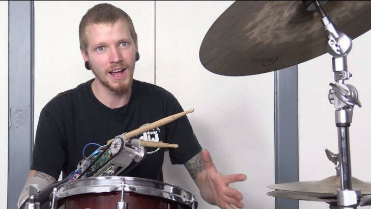 Jason Barnes' robot prosthesis allows him to drum faster than an able-bodied drummer. Photo: Screenshot