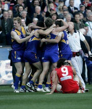 The Eagles celebrate moments after the siren. Photo: John Donegan
