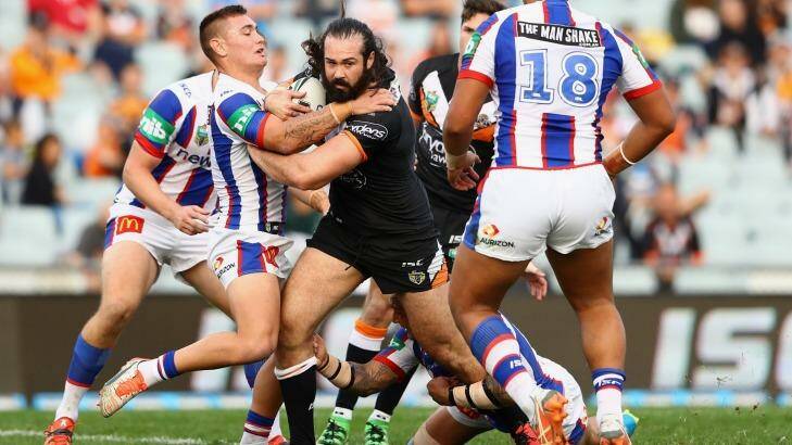 Making a point: Aaron Woods ploughs up the middle. Photo: Getty Images 