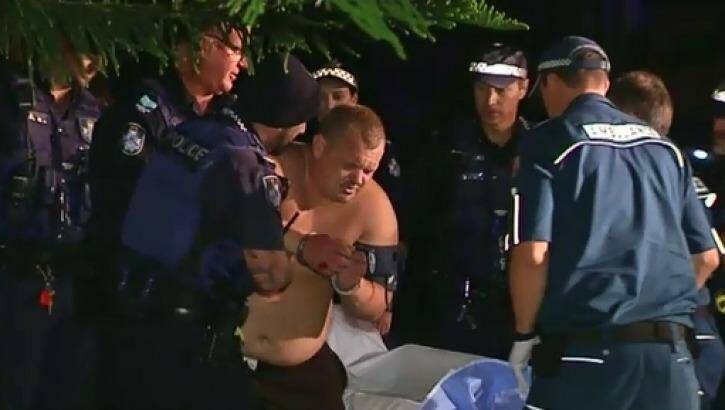 A man is retrieved from a Gold Coast canal on Thursday night. Photo: 9 News Brisbane