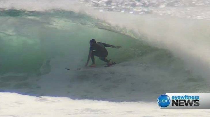 Surfers are enjoying big swells on the Gold Coast.  Photo: Ten News