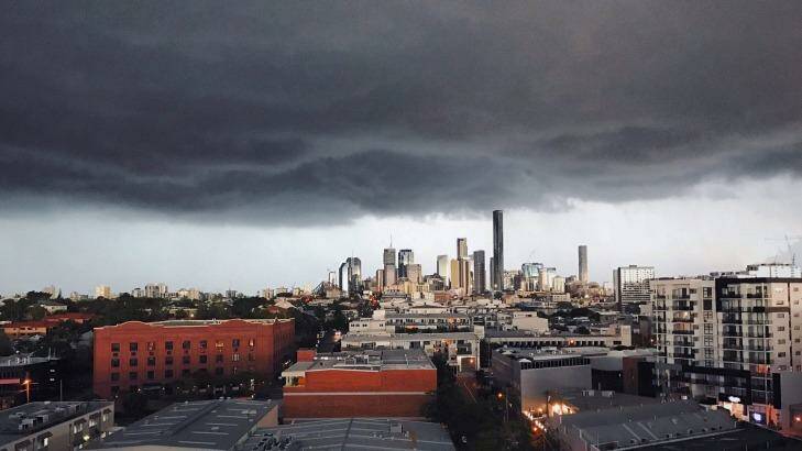 Heavy storm clouds move over Brisbane on Saturday.  Photo: Twitter @JamesFewtrell