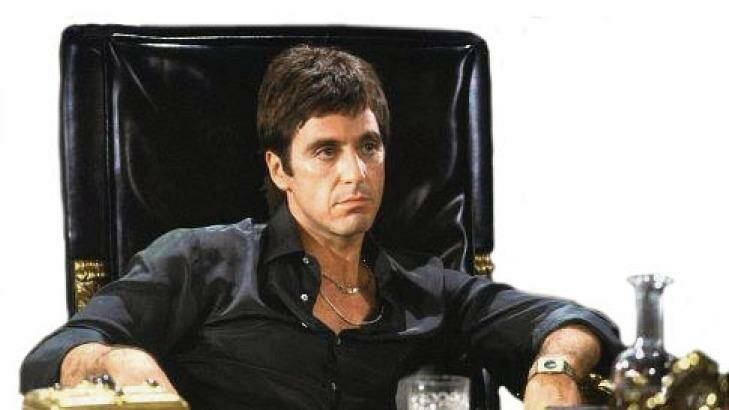 Al Pacino feels the weight of his drug money in <i>Scarface</i>.