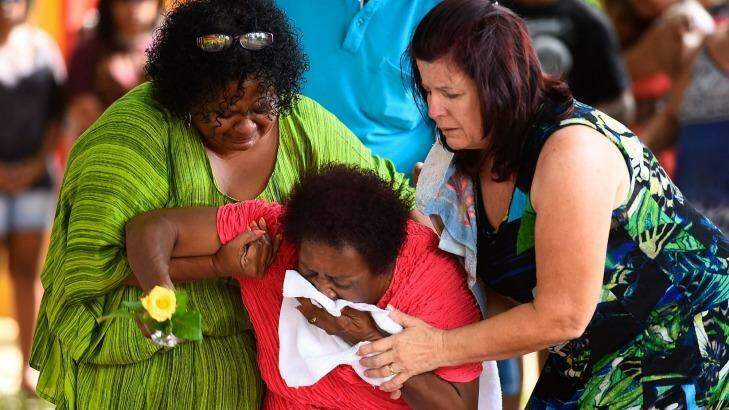Grief stricken loved ones visit the shrine for the eight children killed in Cairns. Photo: Ian Hitchcock/Getty Images