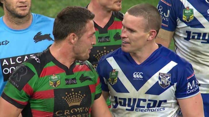 Up close and personal: Sam Burgess and Tim Browne rekindle an old feud on Friday night. Photo: Fox Sports