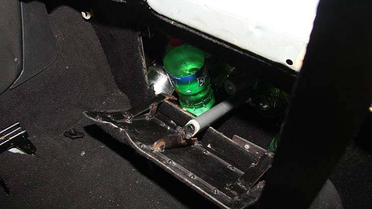 The steel safe hidden behind the front passenger seat of the Holden ute. Photo: Supplied