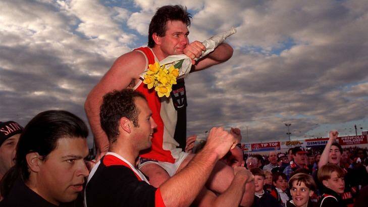 Danny Frawley is chaired off after his last game for St Kilda. Photo: Vince Caligiuri
