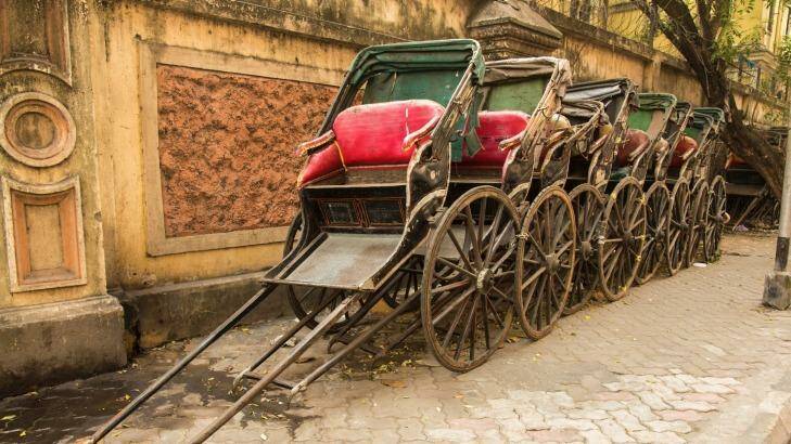 Rickshaws in front of an old building in Kolkata.  Photo: iStock