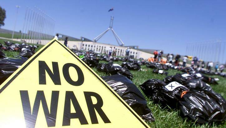 Protests against the Iraq war at Parliament House in Canberra in December 2002. Photo: Pat Scala
