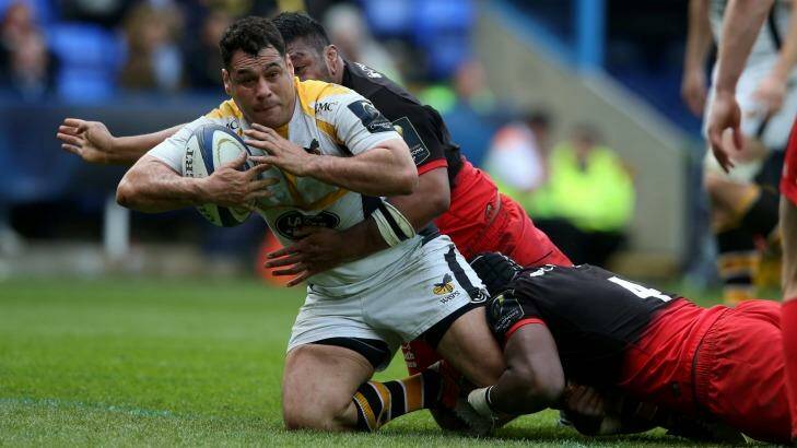 Overseas sojourn: Wasps' George Smith is tackled during the European Rugby Champions Cup semi-final against Saracens in April. Photo: David Rogers
