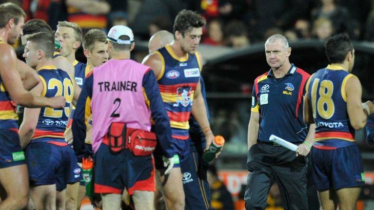 Adelaide coach Phil Walsh with his players in the round-12 match against Hawthorn. Photo: David Mariuz