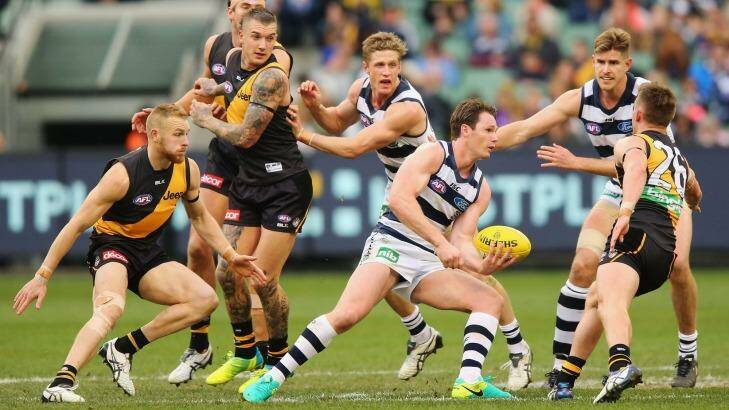 Fast and furious: Geelong midfielder Patrick Dangerfield handballs out of the pack. Photo: Michael Dodge