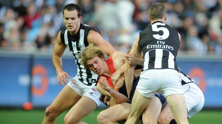 Magpie mauling: Jack Watts is crunched in that first tackle on his Melbourne debut in 2009. Photo: Joe Armao