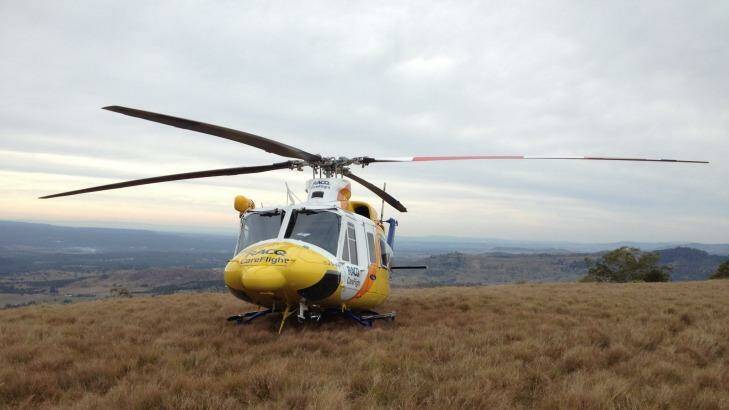 The RACQ Rescue Helicopter on Table Top Mountain where a man was stranded for three days. Photo: Supplied