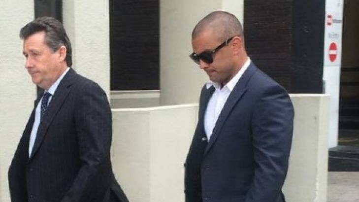 Former Eagle Daniel Kerr (right) arrives at the Perth Magistrates Court.  Photo: Caitlin Barr, 6PR
