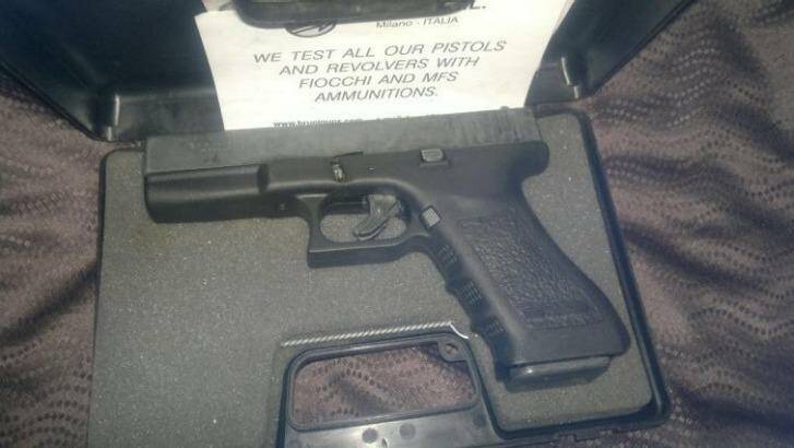 A semi-automatic pistol found in a raid at Kurwongbah. Photo: Supplied