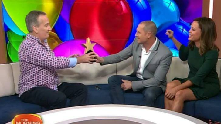 Happy birthday ... Glenn Wheeler receives gifts from good mate Larry Emdur on the Morning Show. Photo: Channel Seven