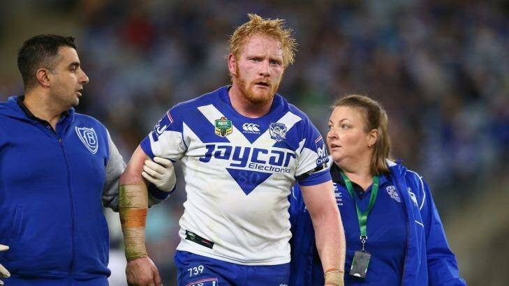 James Graham of the Bulldogs leaves the field after being knocked out during the round 10 NRL match between the Canterbury Bulldogs and the Sydney Roosters at ANZ Stadium on May 15, 2015 in Sydney, Australia.  Photo: Mark Kolbe