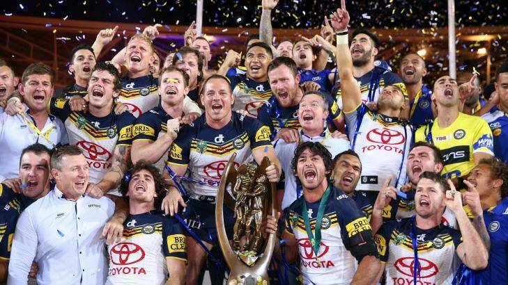 Title to defend: The Cowboys celebrate on the podium with the premiership trophy after winning the 2015 NRL Grand Final match over the Brisbane Broncos. Will North Queensland win again in 2016? Photo: Cameron Spencer