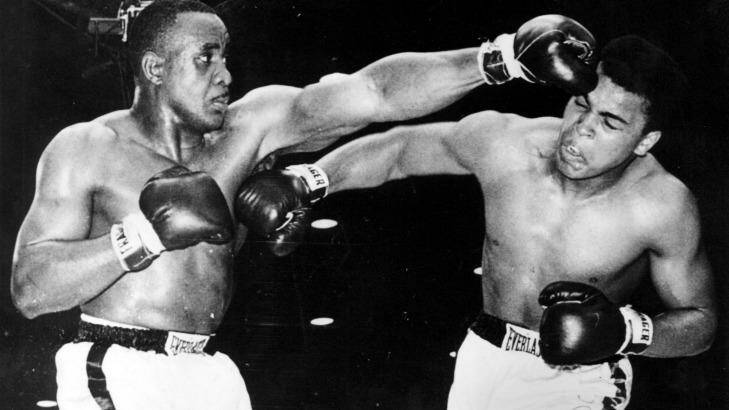 Trauma: Muhammad Ali on the end of a punch from Sonny Liston during his career-making win in 1964.
 Photo: Allsport/Getty Images
