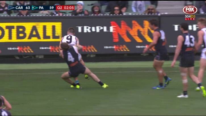 Headed for trouble: Carlton's Bryce Gibbs was banned for this tackle on Port Adelaide's Robbie Gray. Photo: Fox Footy