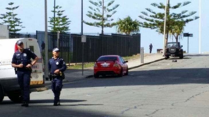 Police have closed a Surfers Paradise street after a man reportedly made threats with molotov cocktails. Photo: Matthew Howard/Ten News, via Twitter