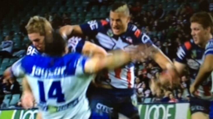 The incident: Bulldogs prop Sam Kasiano hits the deck after a Kane Evans shoulder charge. Photo: Channel Nine